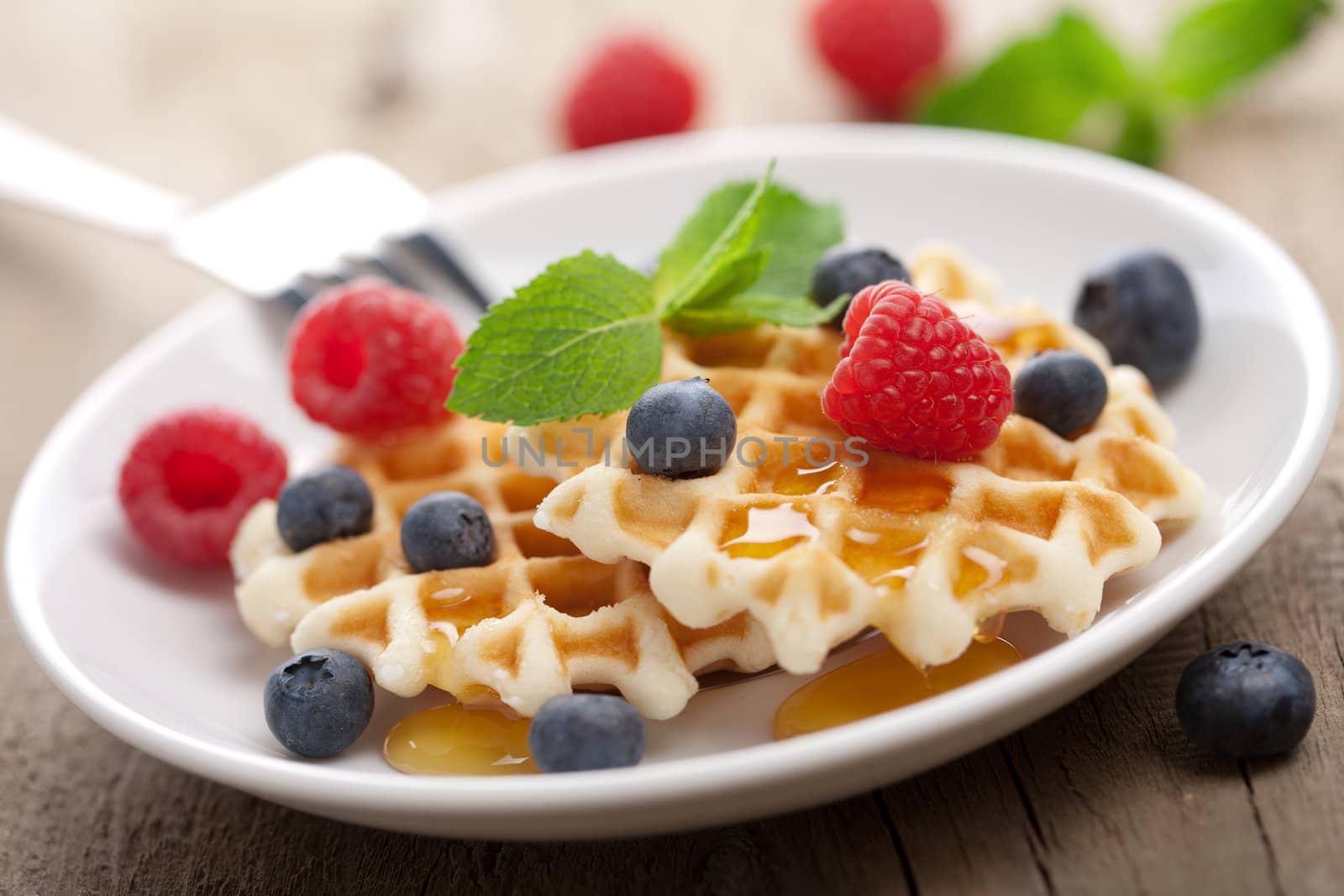 waffles with fresh berries and honey