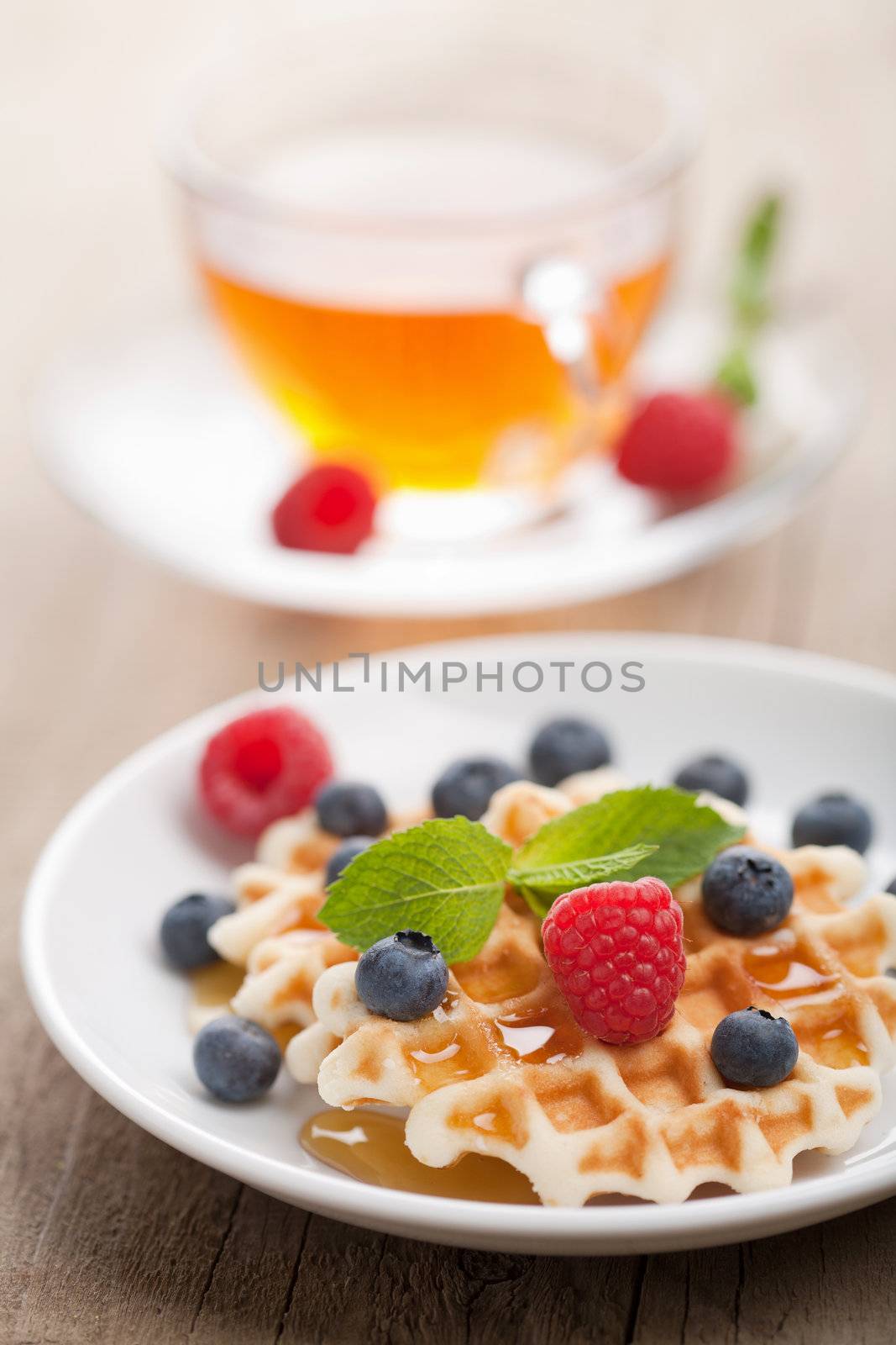 waffles with fresh berries and honey 