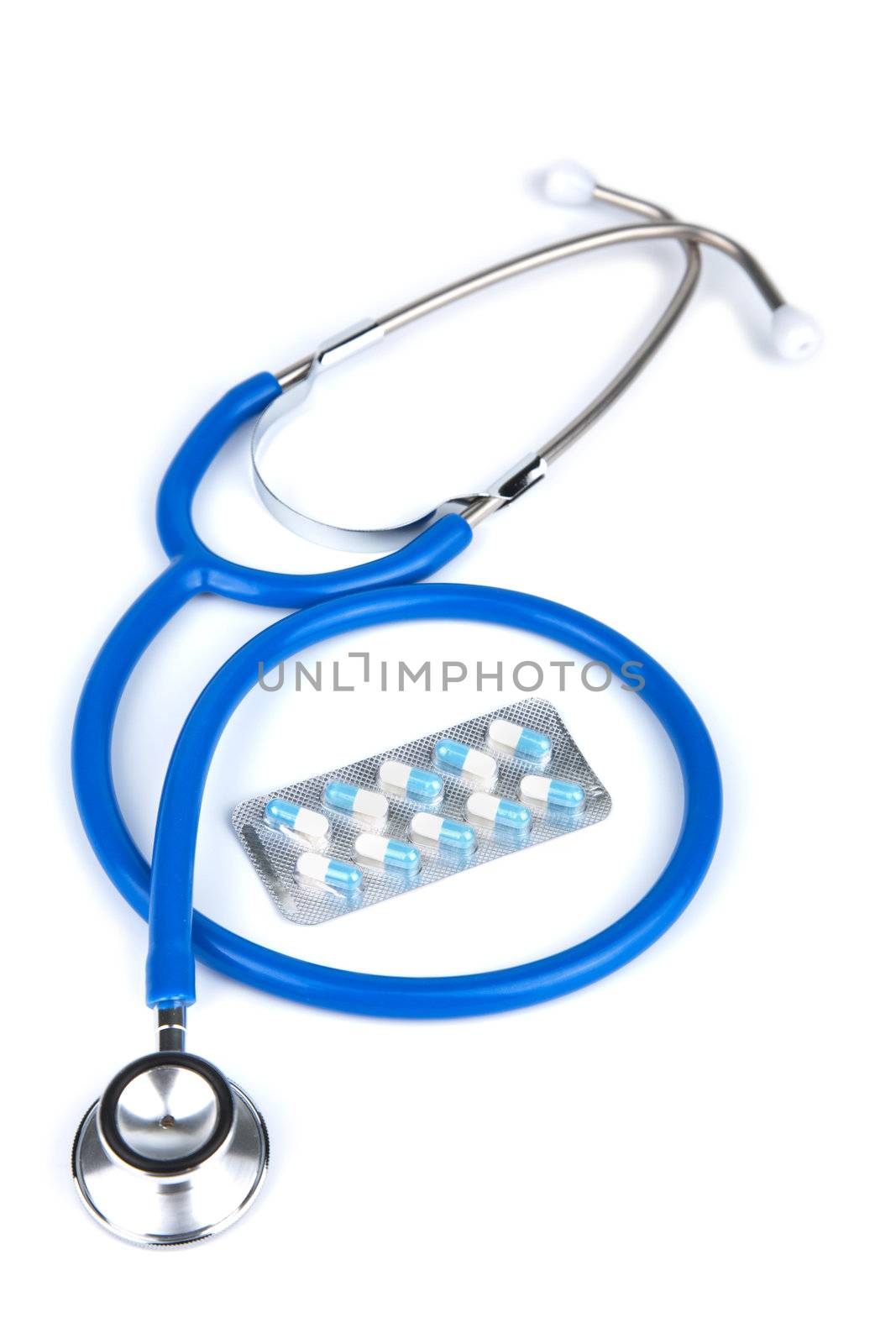 stethoscope and pills isolated 