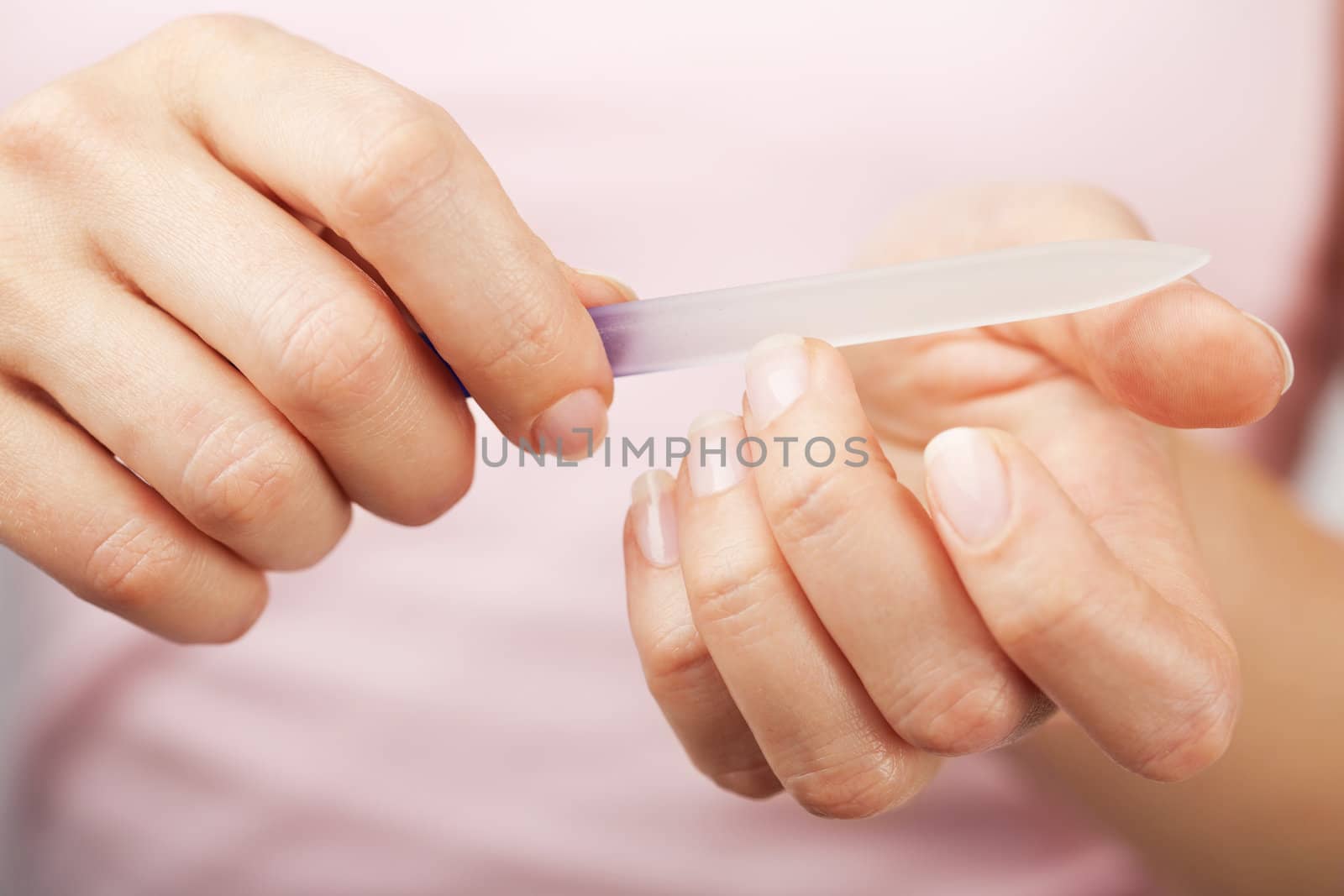 beautiful woman hands with nail file 