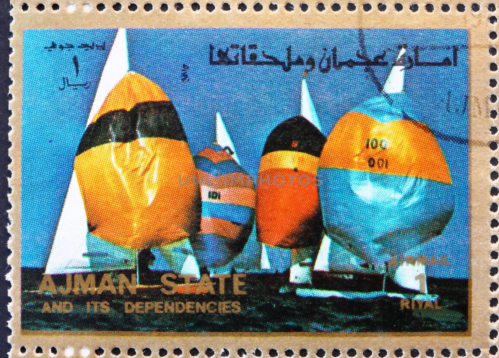 AJMAN - CIRCA 1973: a stamp printed in the Ajman shows Sailing, Summer Olympics, circa 1973