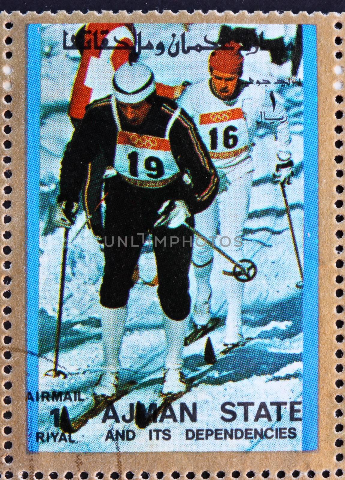AJMAN - CIRCA 1973: a stamp printed in the Ajman shows Cross-country Skiing, Winter Olympics, circa 1973