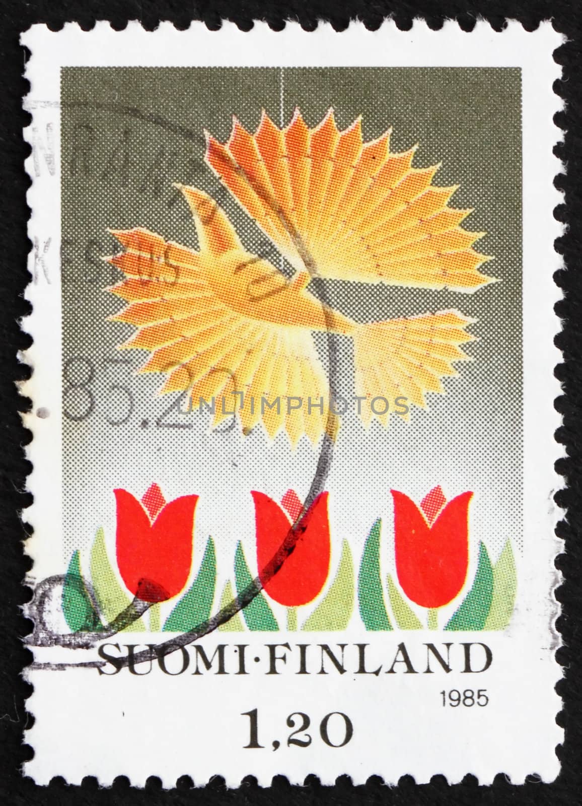 FINLAND - CIRCA 1985: a stamp printed in the Finland shows Bird and Tulips, Christmas, circa 1985