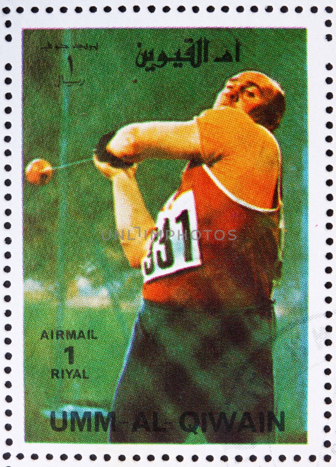 UMM AL-QUWAIN - CIRCA 1972: a stamp printed in the Umm al-Quwain shows Hammer Throwing, Athletics, Summer Olympics, Munich 1972, circa 1972