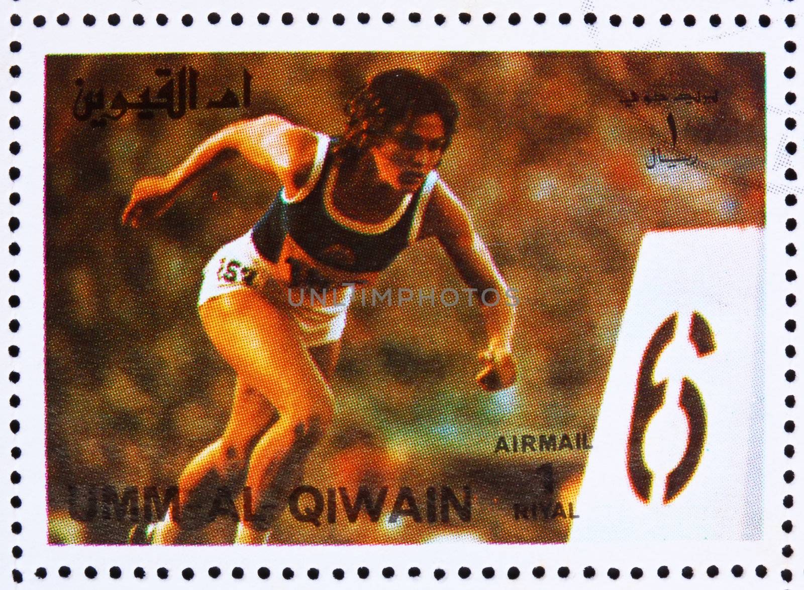 UMM AL-QUWAIN - CIRCA 1972: a stamp printed in the Umm al-Quwain shows Sprint, Running, Athletics, Summer Olympics, Munich 1972, circa 1972