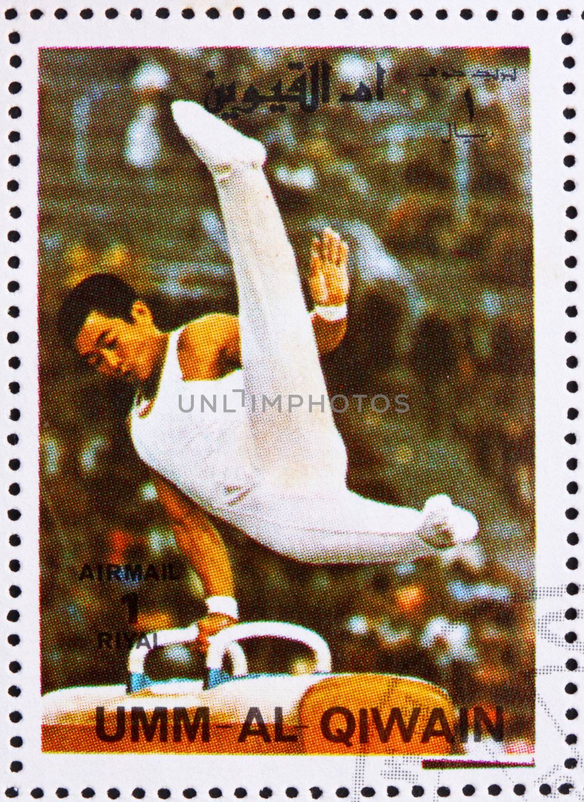 UMM AL-QUWAIN - CIRCA 1972: a stamp printed in the Umm al-Quwain shows Pommel Horse, Gymnastics, Summer Olympics, Munich 1972, circa 1972