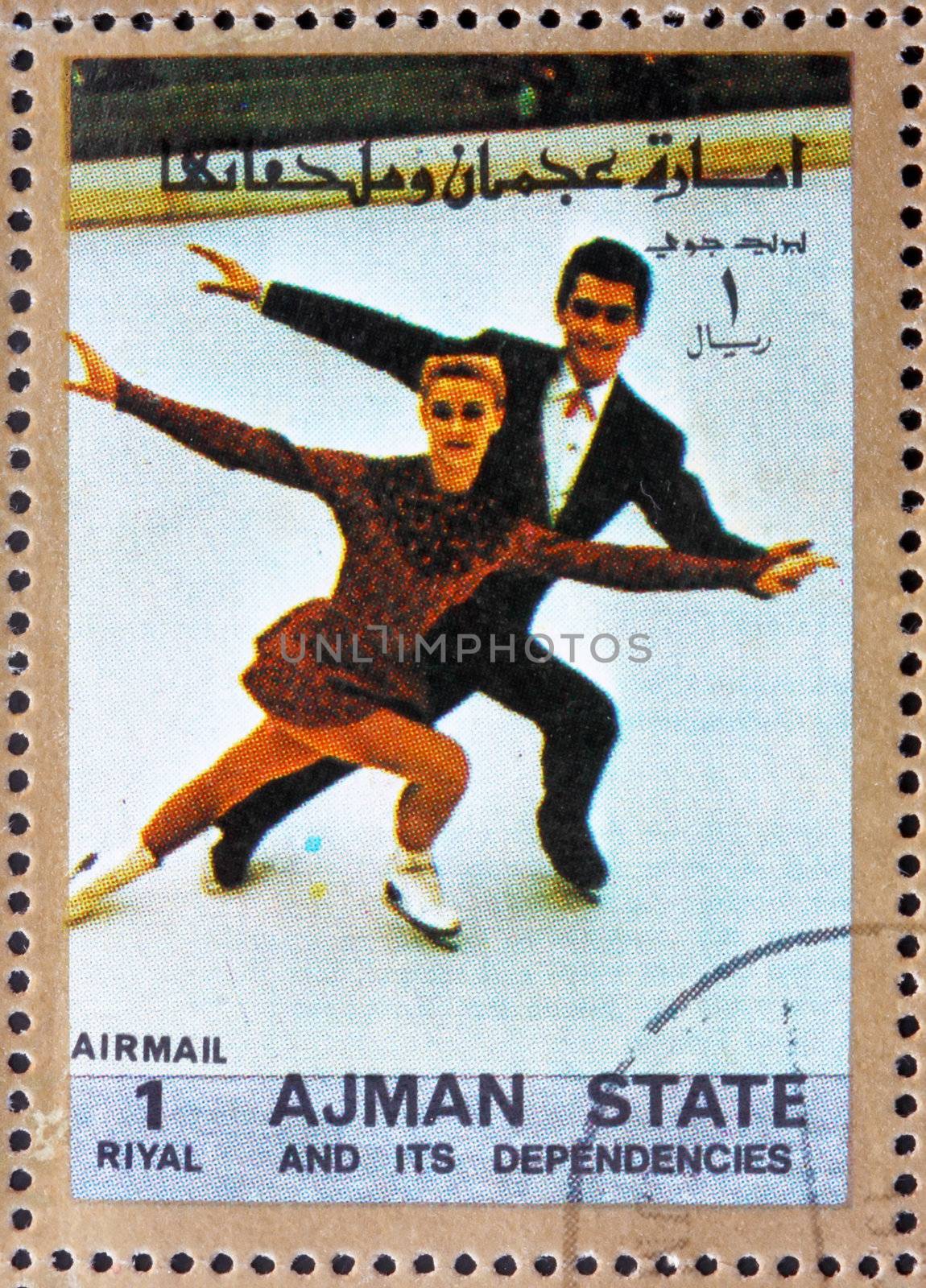 AJMAN - CIRCA 1973: a stamp printed in the Ajman shows Figure Skating, Ice Dancing, Winter Olympics, circa 1973