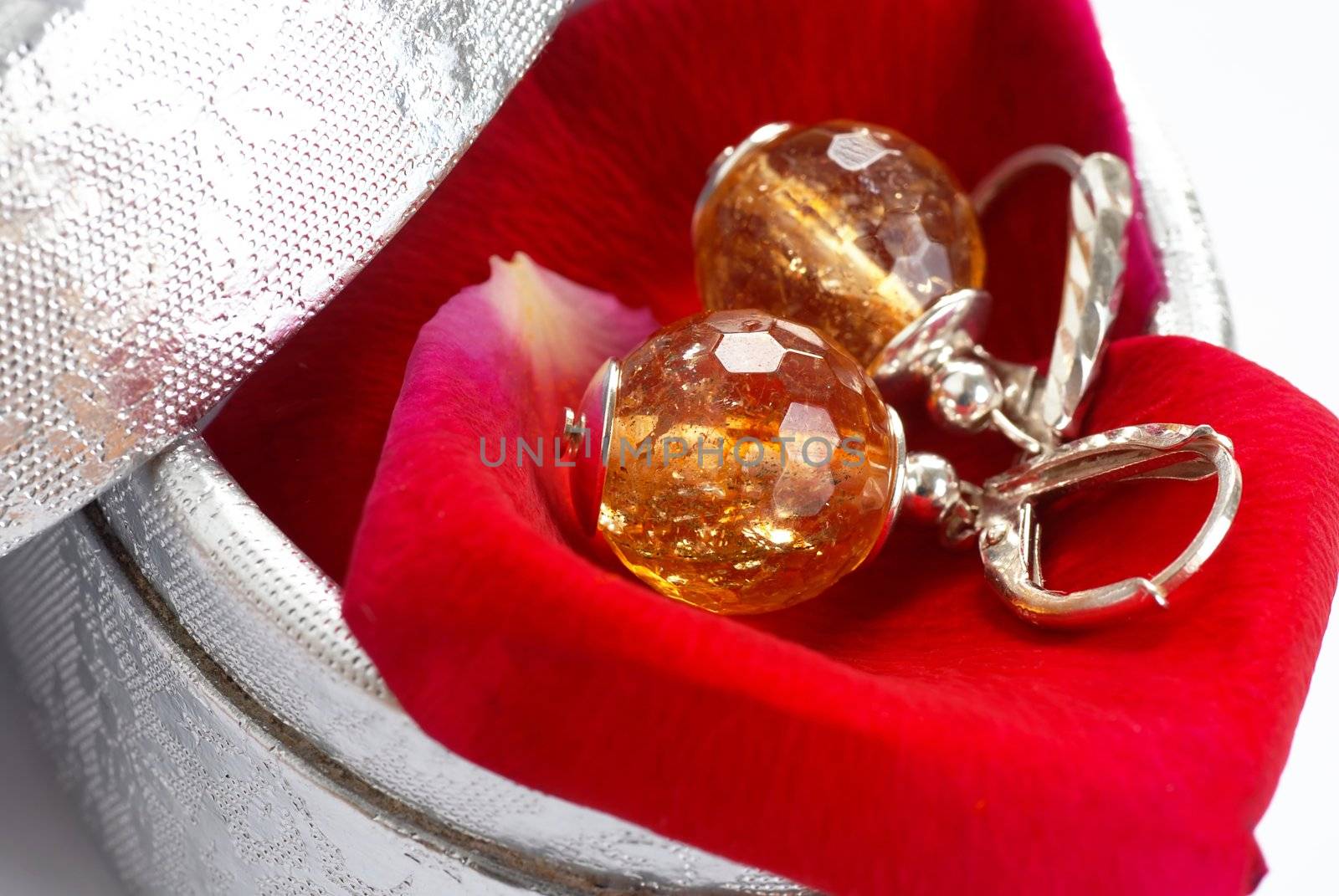 closeup of silver earrings in silver gift box closeup