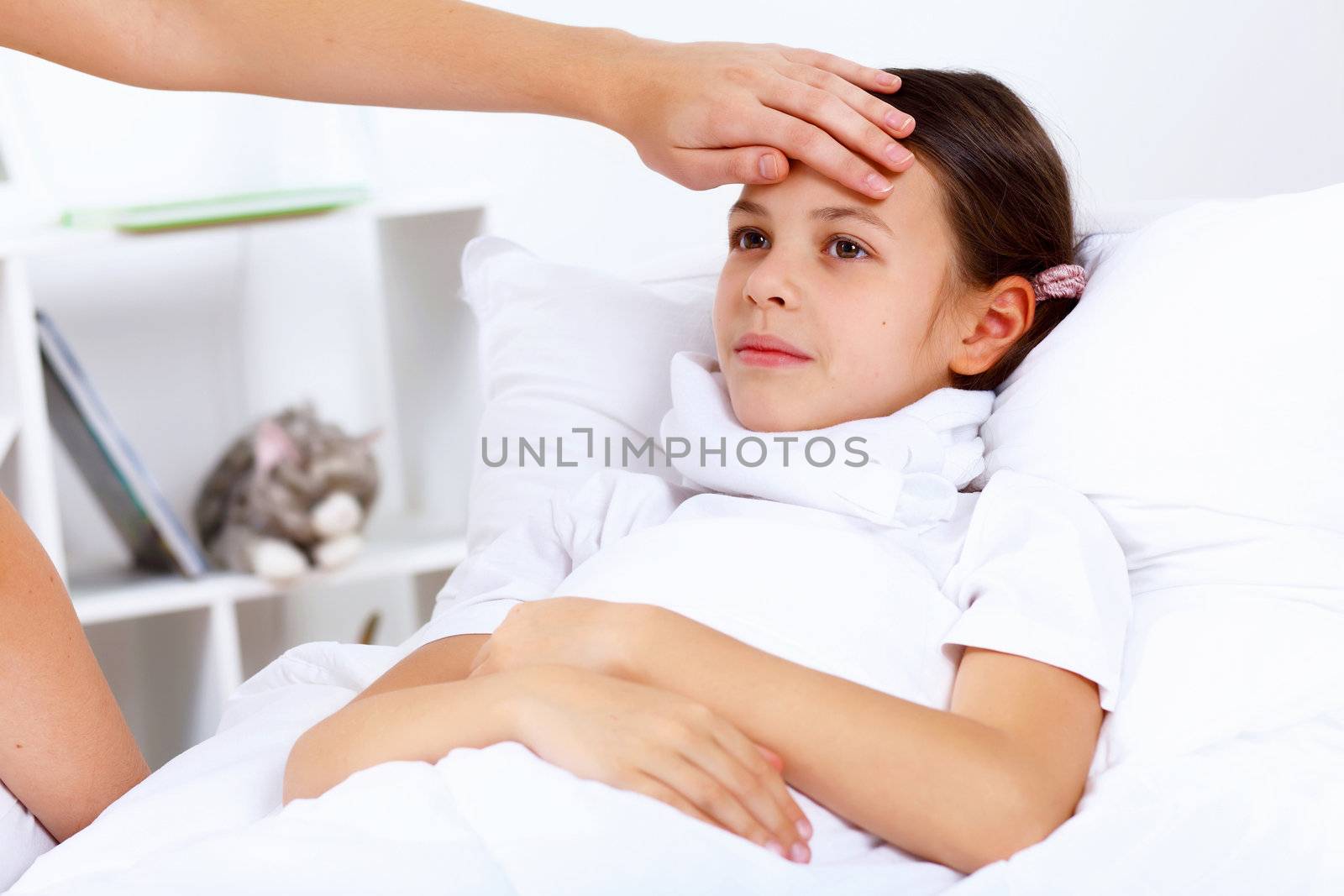 Little girl with illness at bed at home