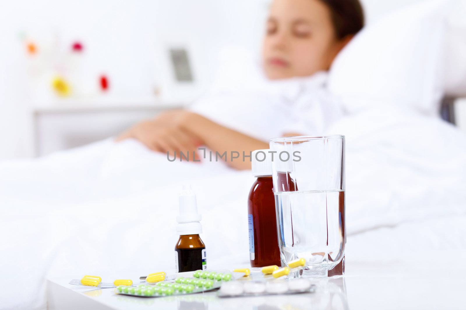 Little girl with illness at bed at home