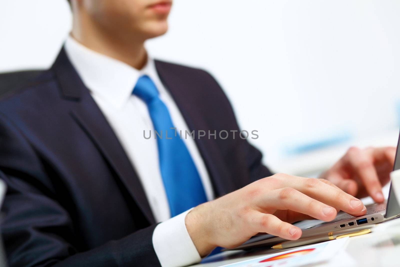 Young manager working with notebook in the office