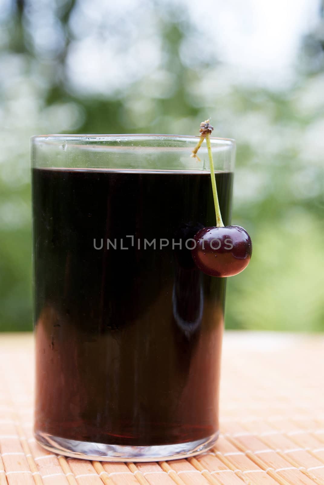 Glass of natural fresh cherry juice by sergey150770SV