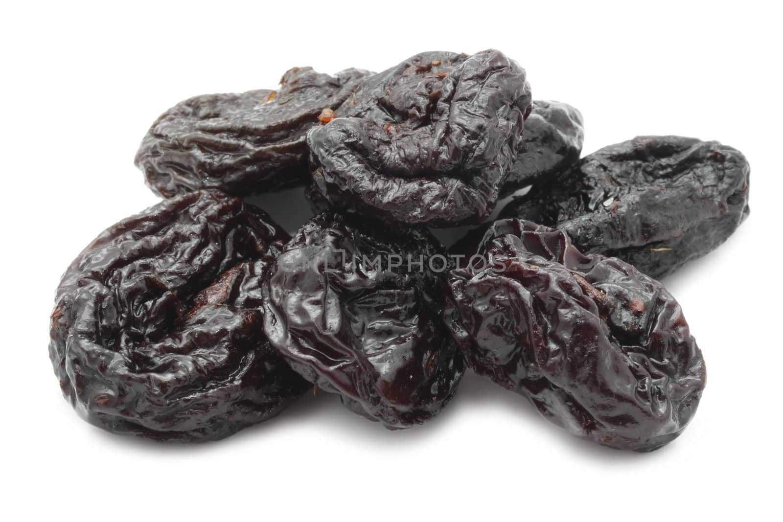 Dry prunes isolated on white