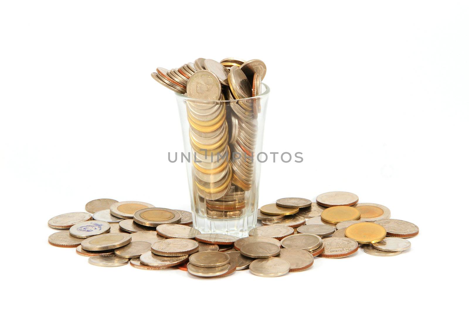 Coins in glass can isolated on white background by rufous