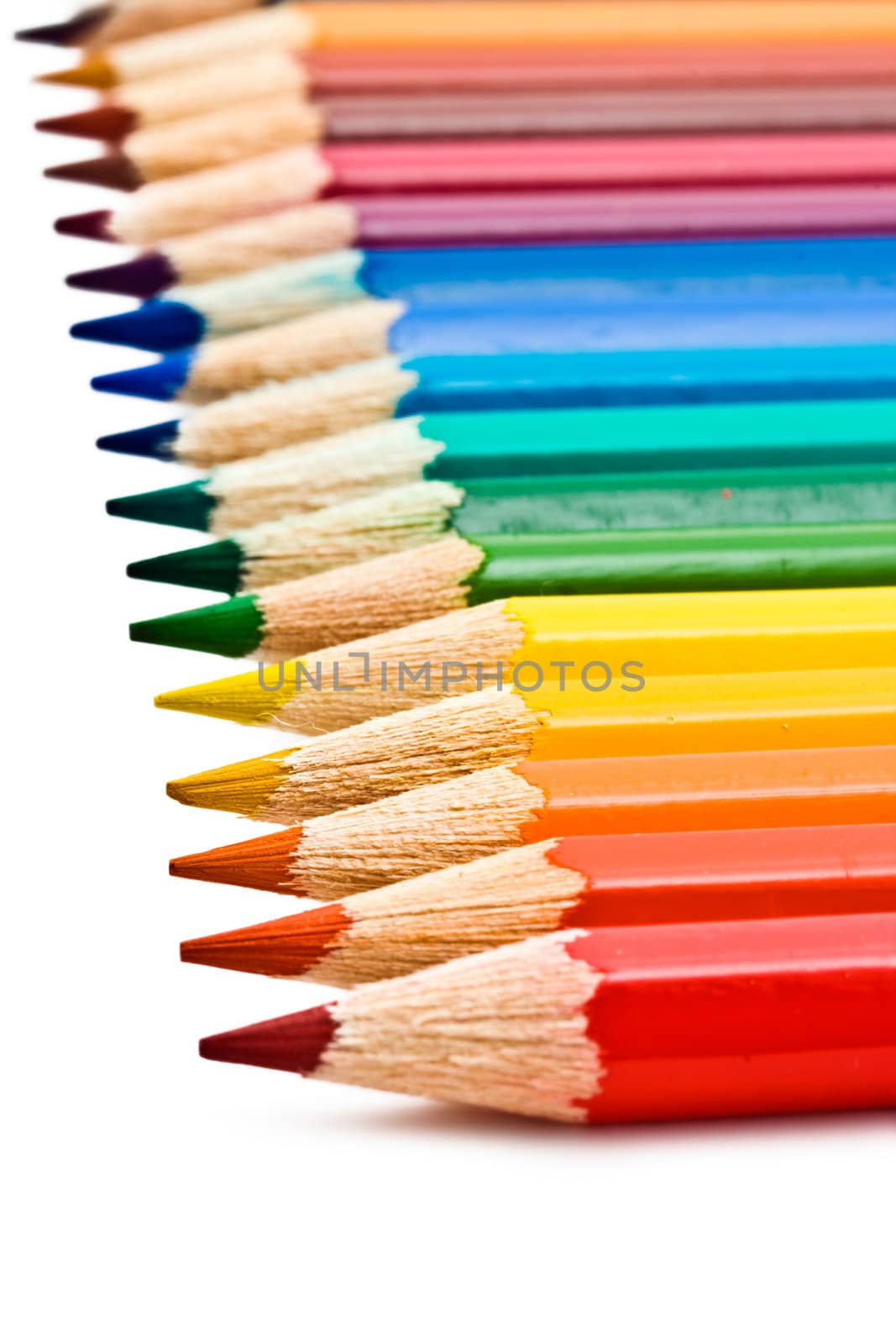 Coloured pencils with shadow on white background