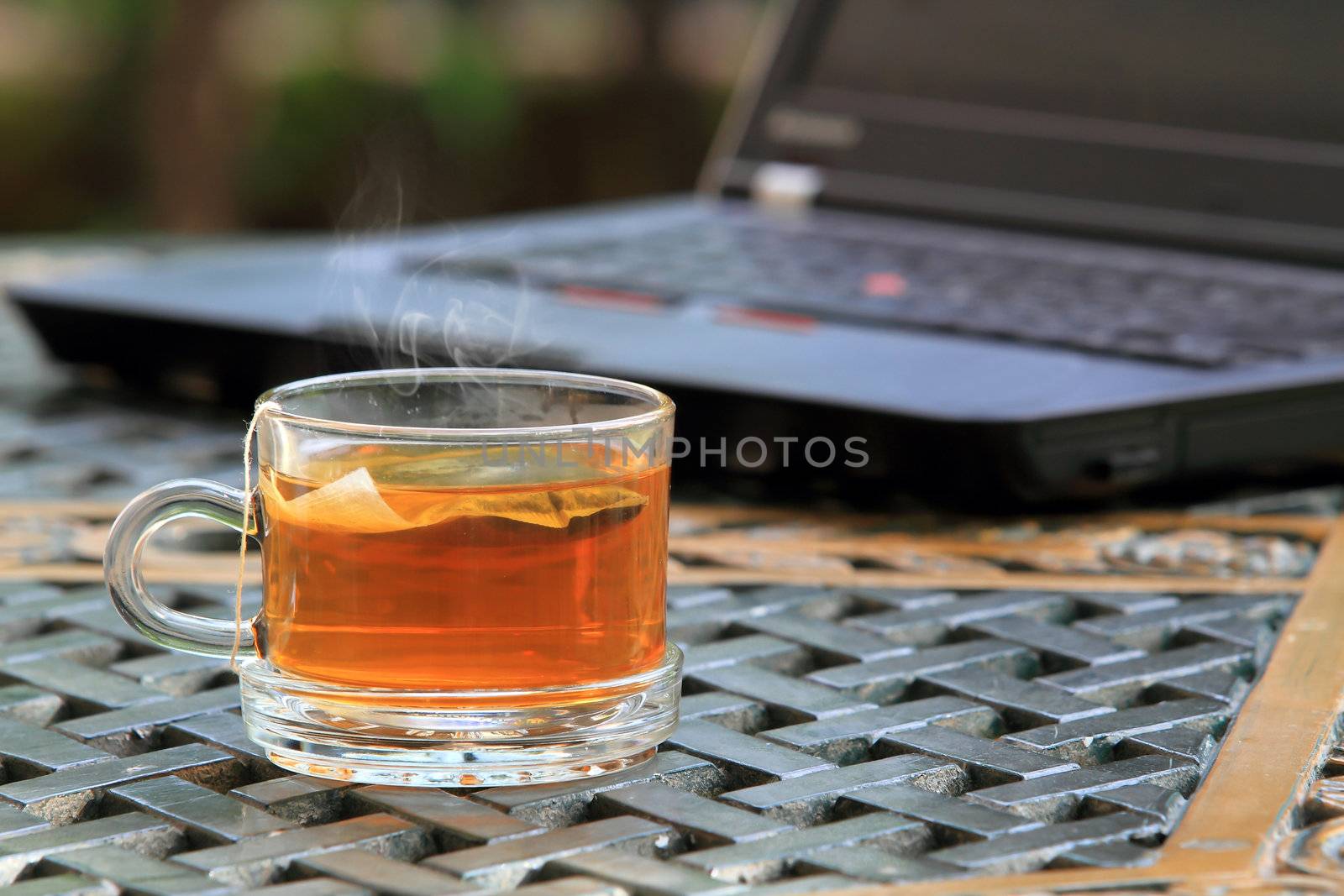 Laptop keyboard and tea cup