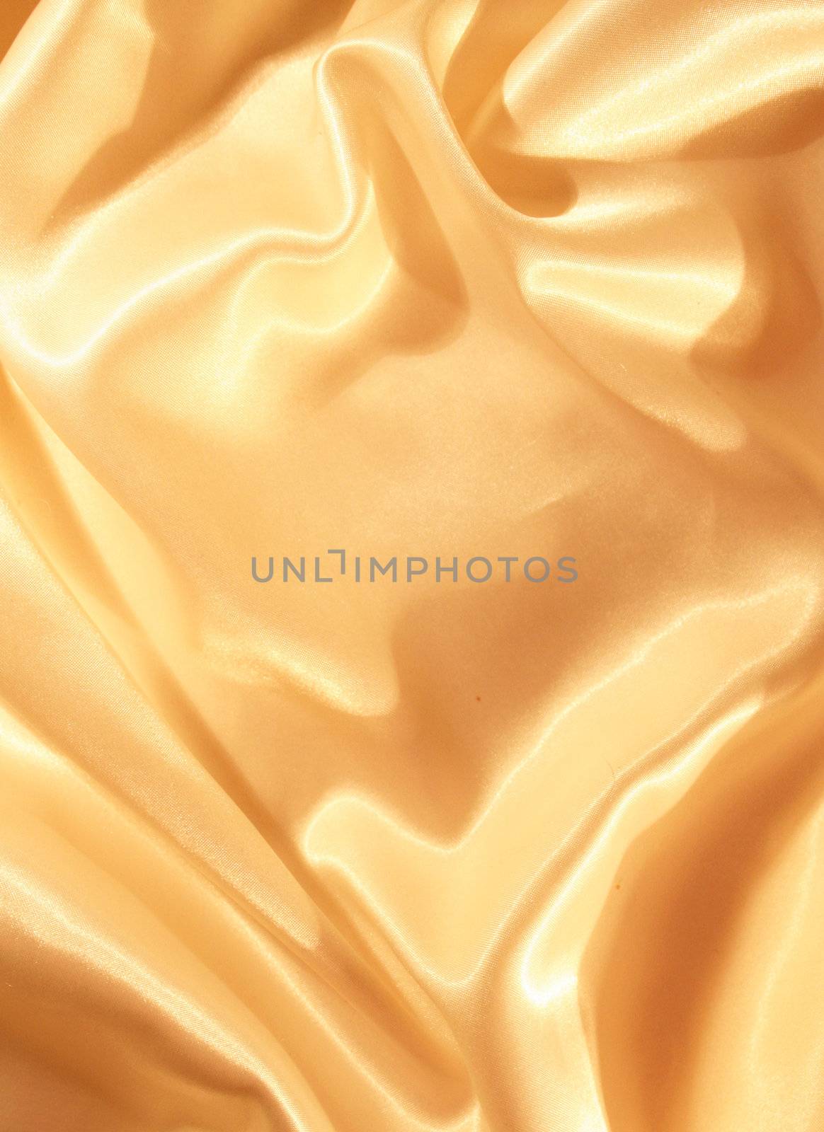 Smooth elegant golden silk as background by oxanatravel