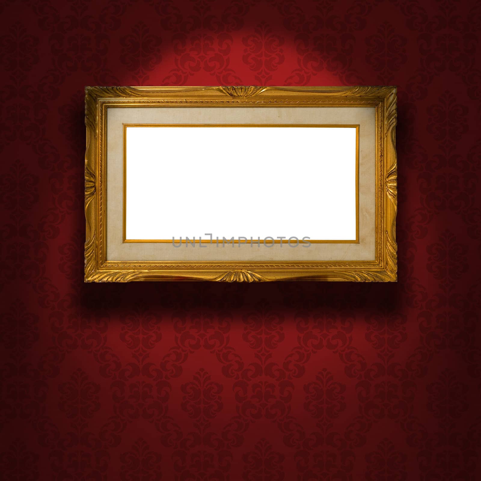 Empty golden frame on the wall. by faberfoto