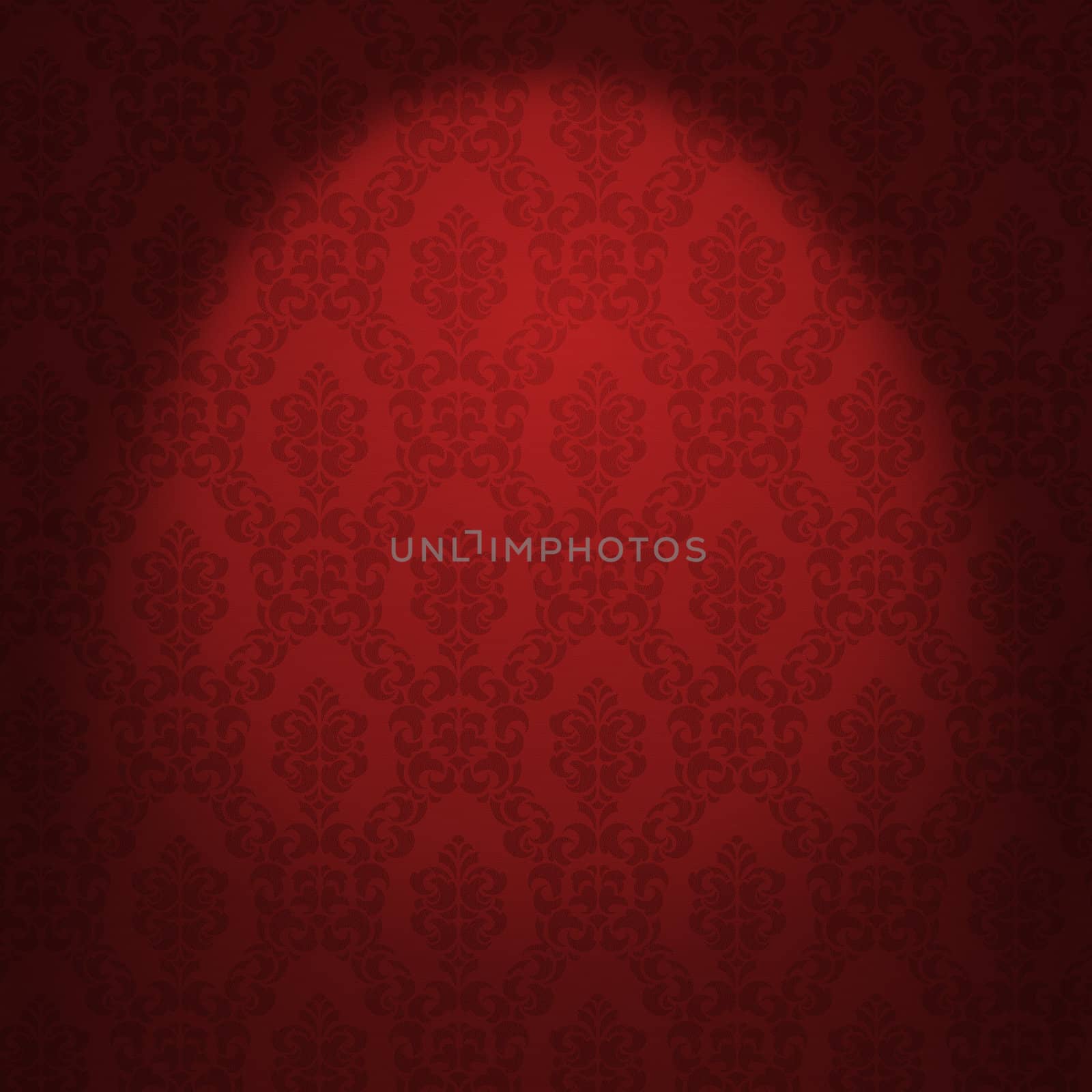 Red damask wallpaper illuminated from a spotlight. 