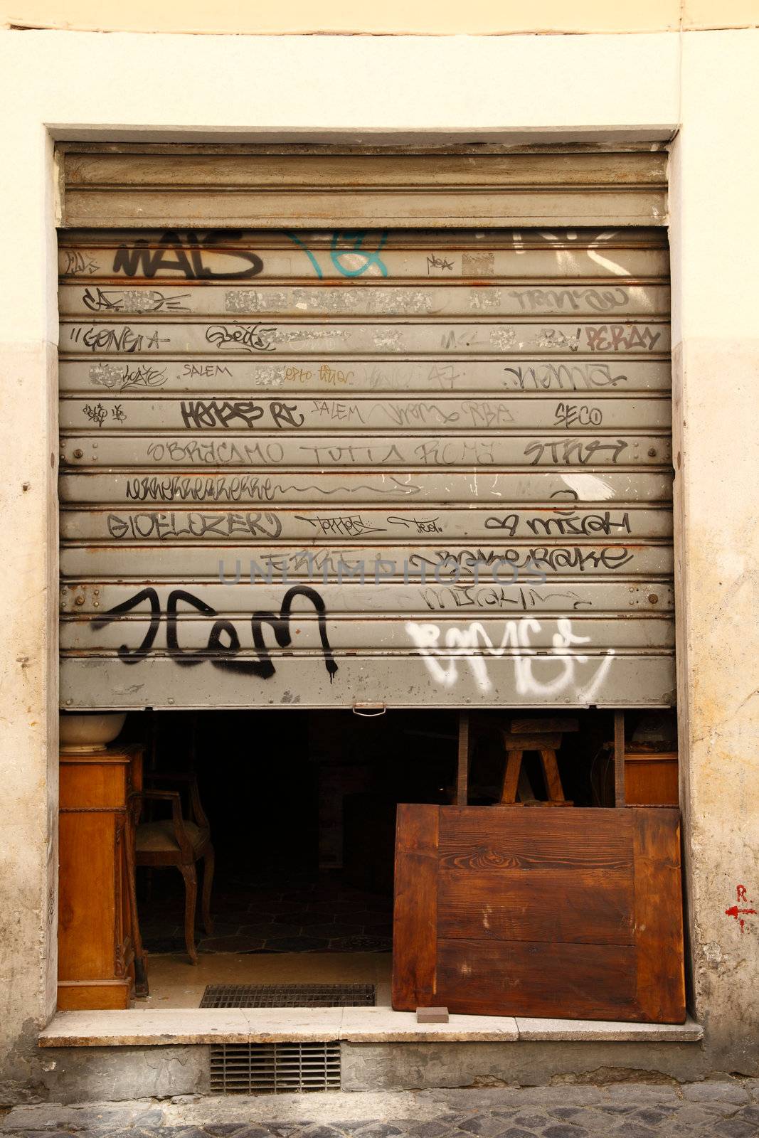 Graffiti art on doors in Rome street