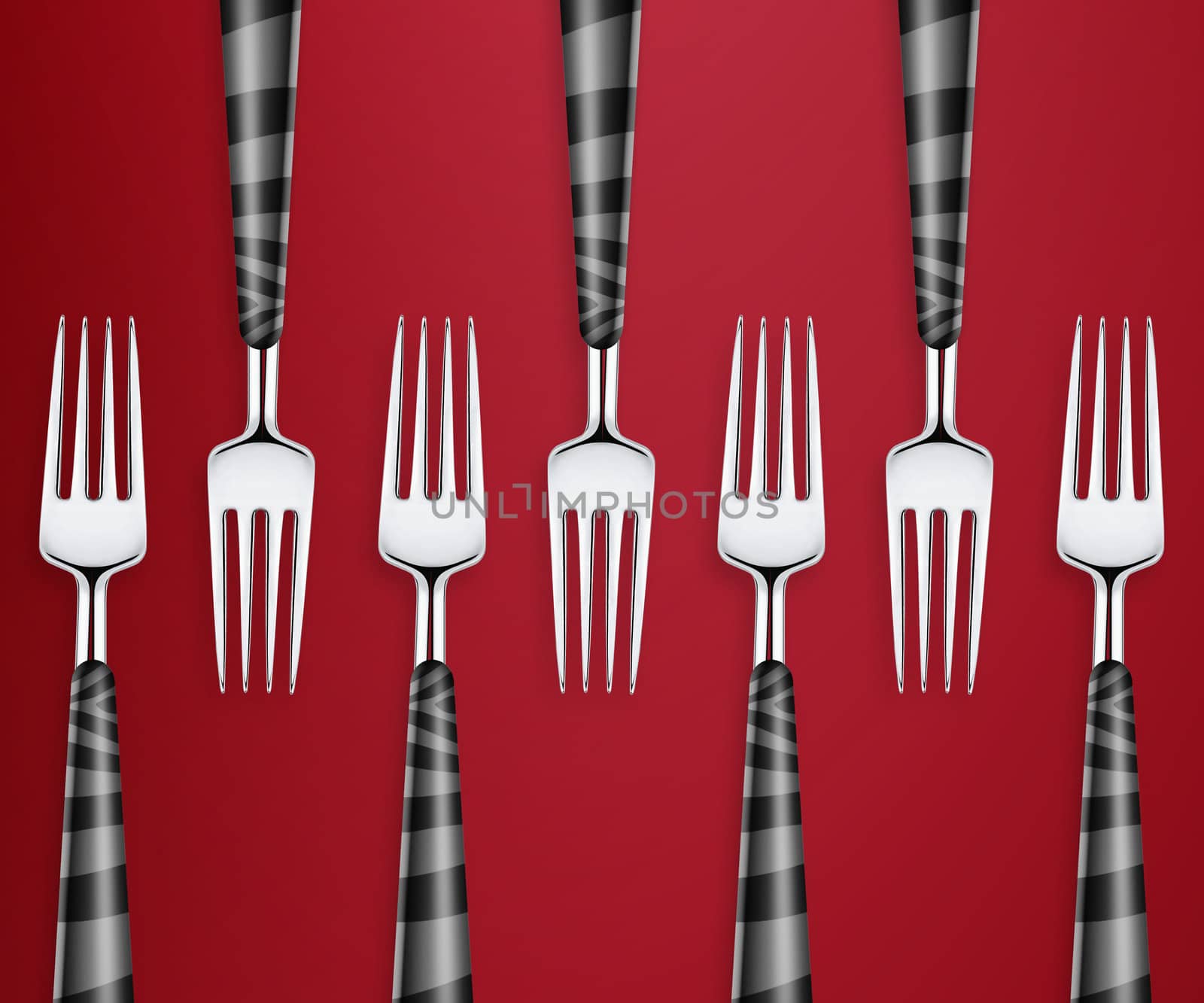 Set of forks on red background