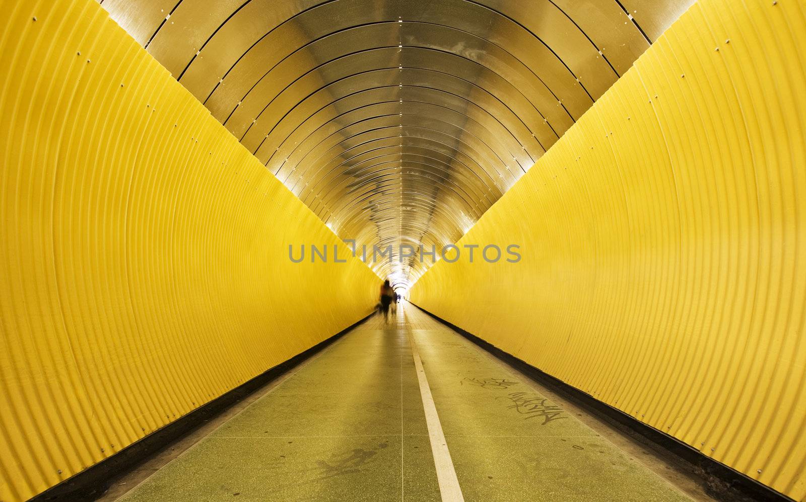 Yellow tunnel with people out of focus