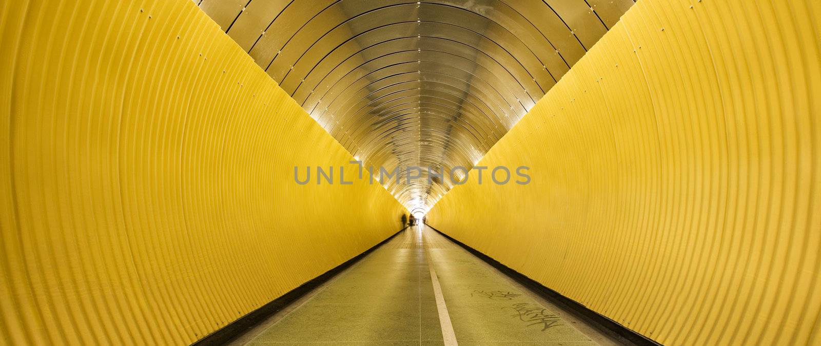 Yellow tunnel with people out of focus