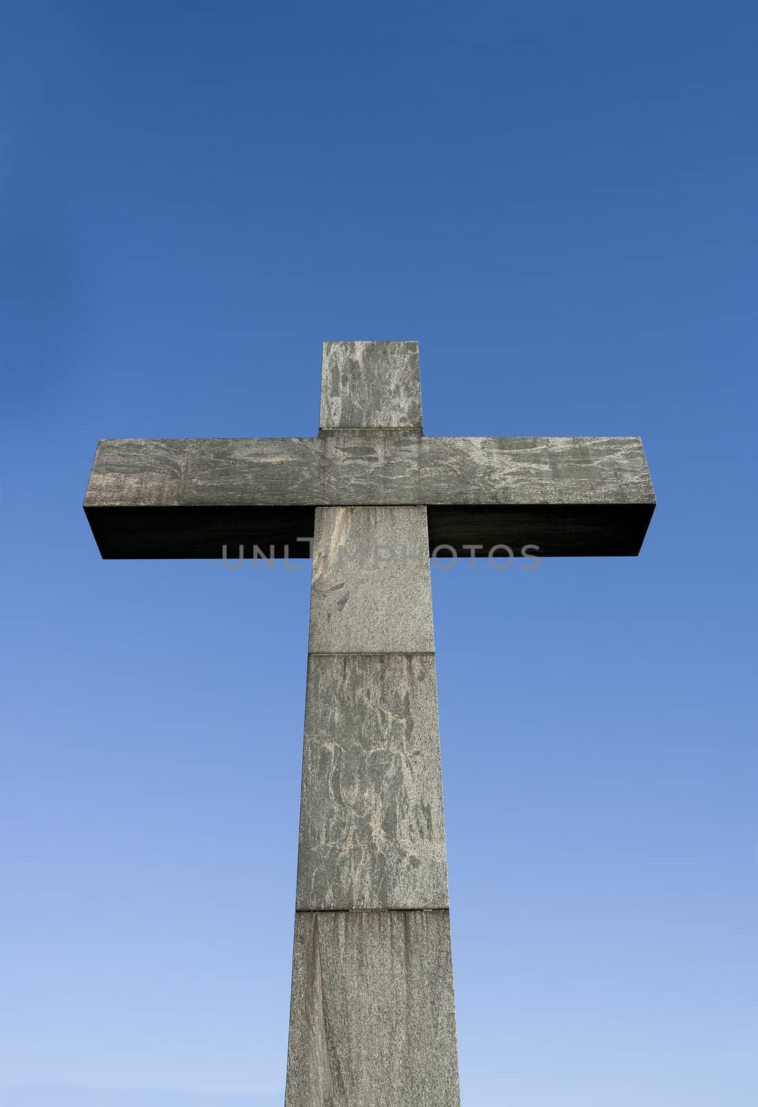 Cross symbol in front of blue sky