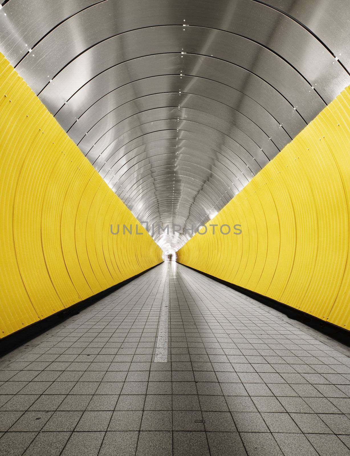 Yellow tunnel with people out of focus