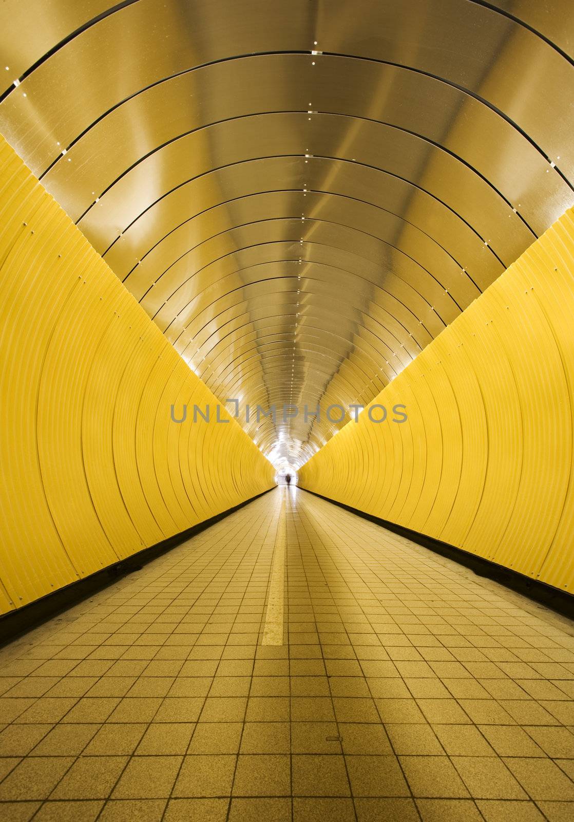 Yellow tunnel with people out of focus