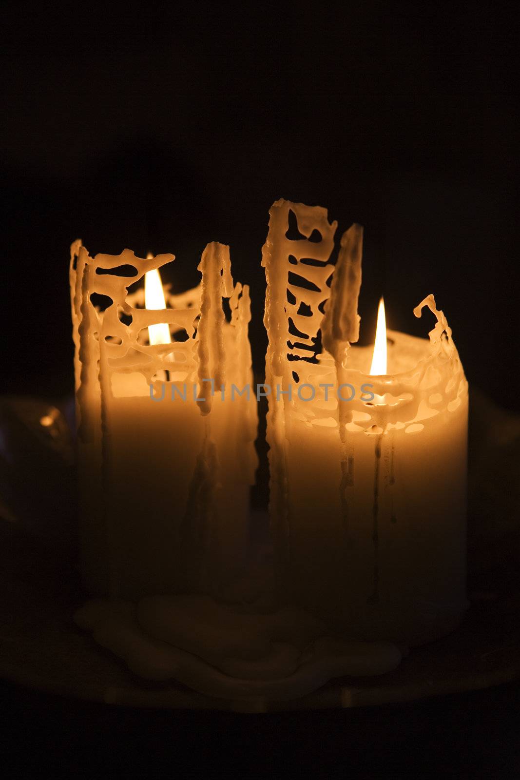 Burning candles on black background