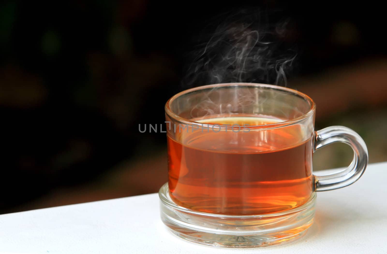 A glass bowl with hot Chinese tea