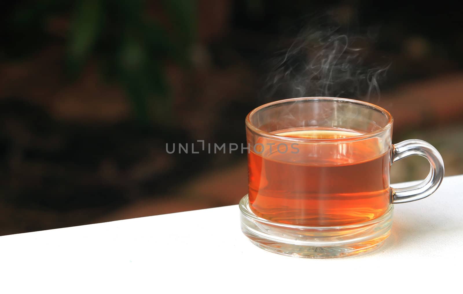 A glass bowl with hot Chinese tea