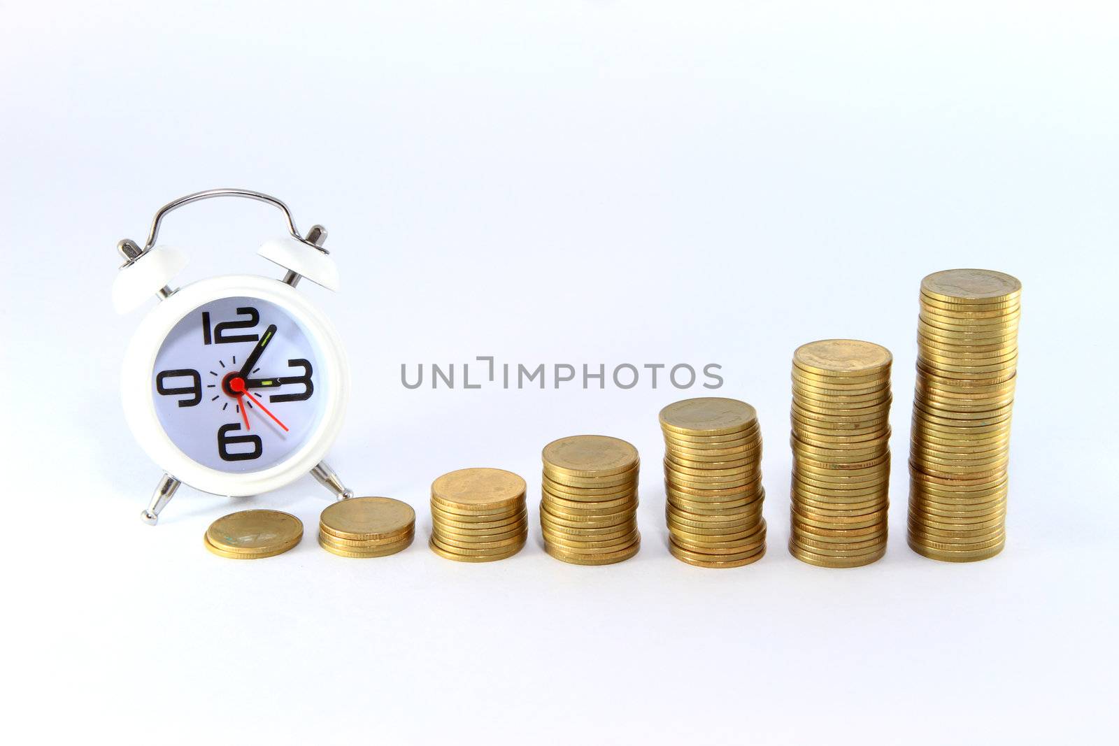 Alarm clock and money isolated on white by rufous
