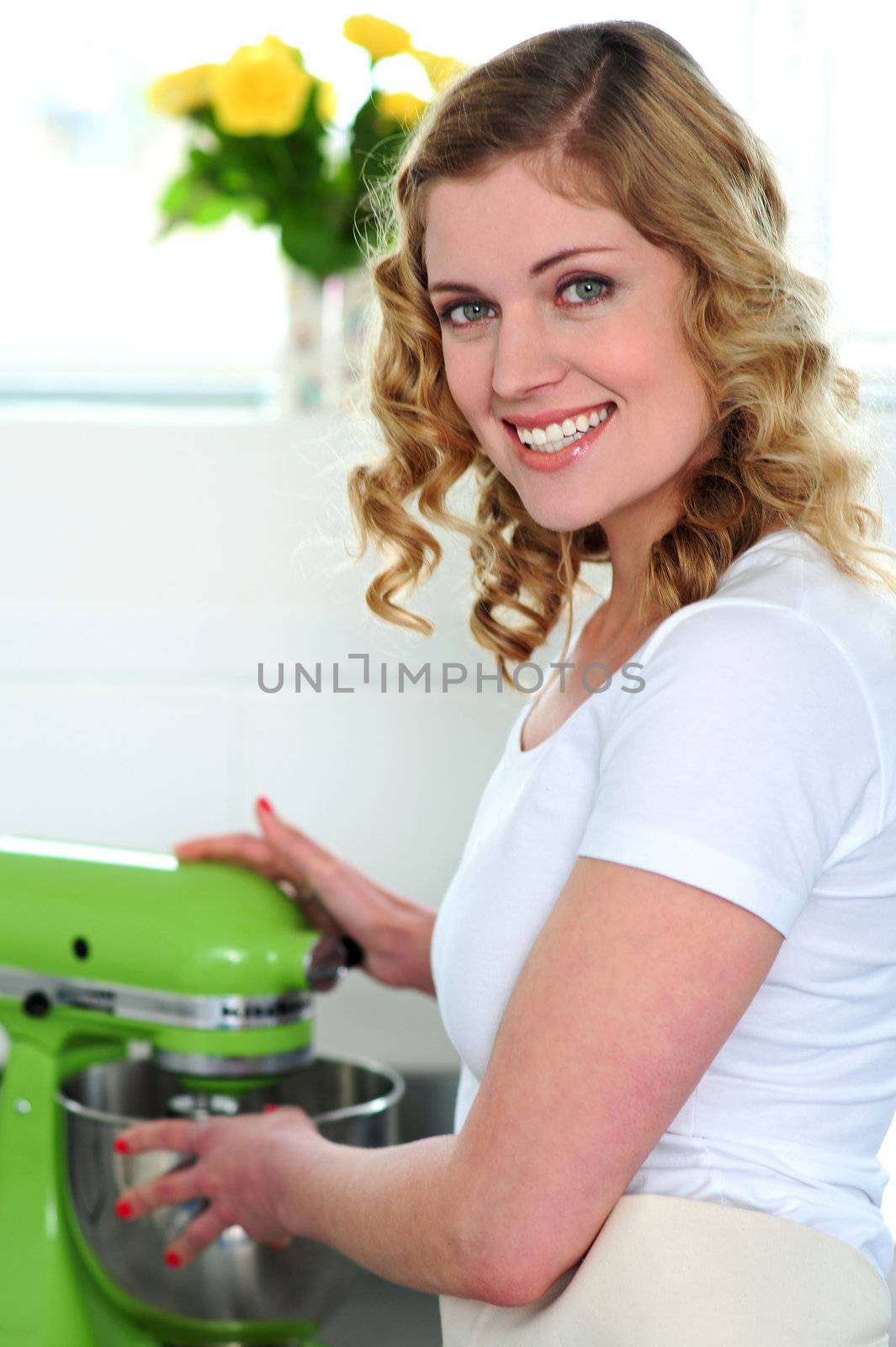 Pretty female chef at work in restaurant kitchen