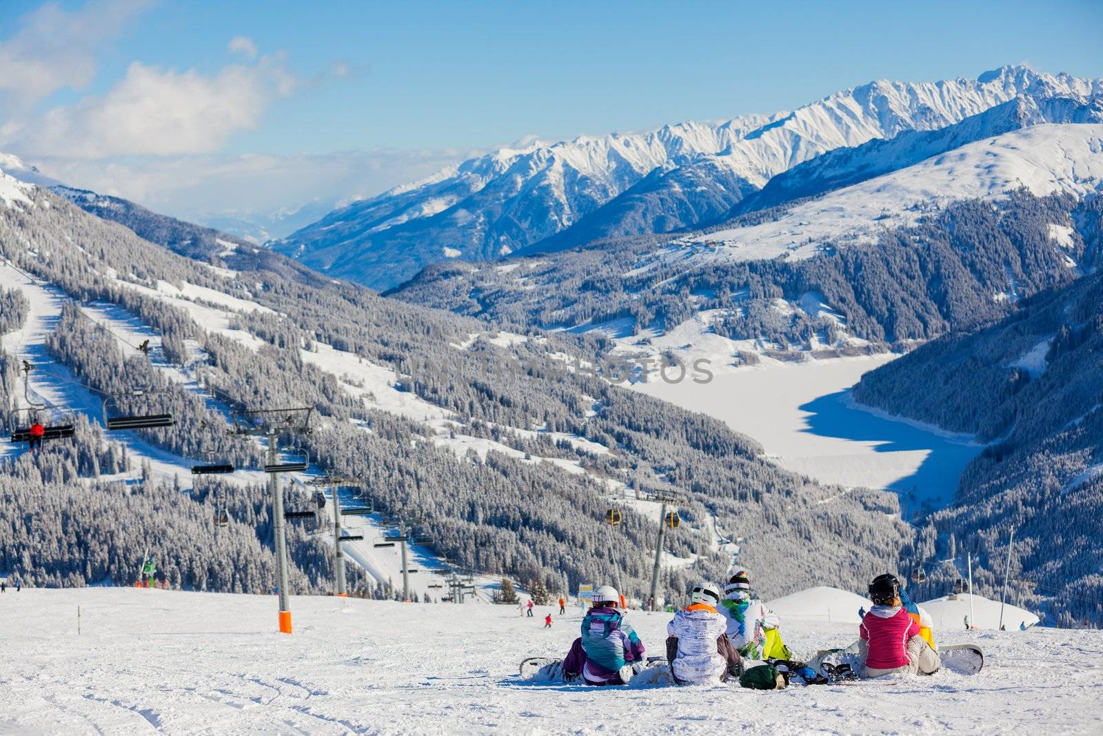 Snowboarders on the Alpine skiing resort in Austria Zillertal