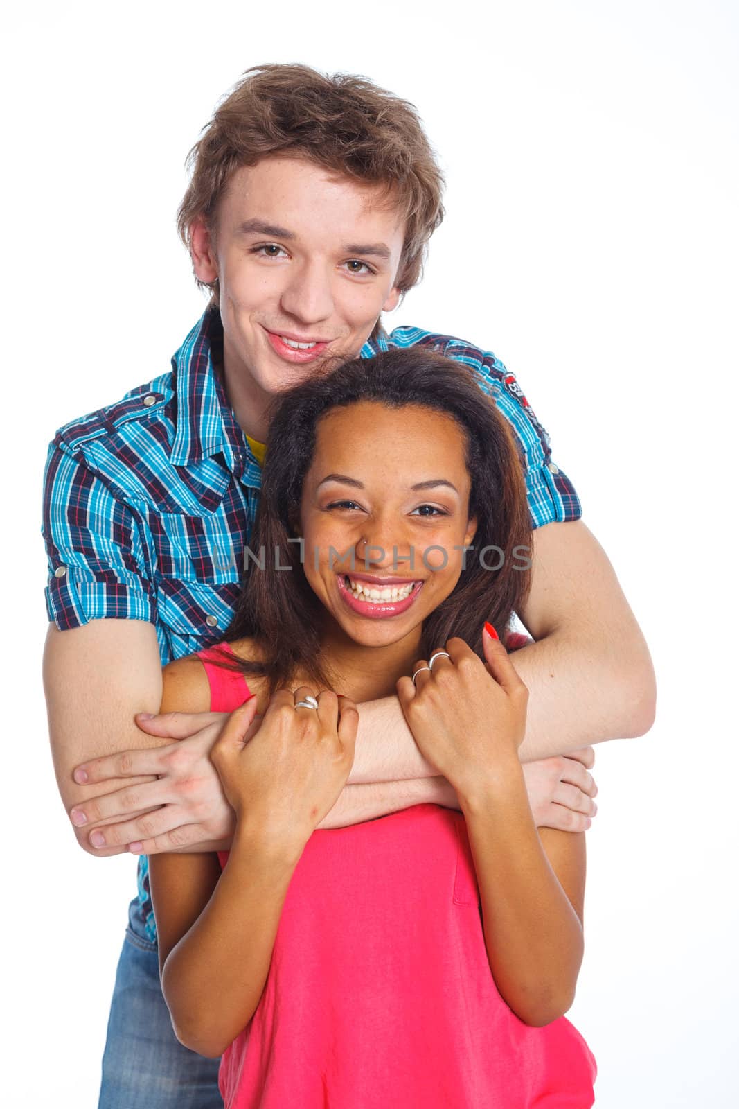 Smiling young man with pretty girlfriend. Isolated on white background.