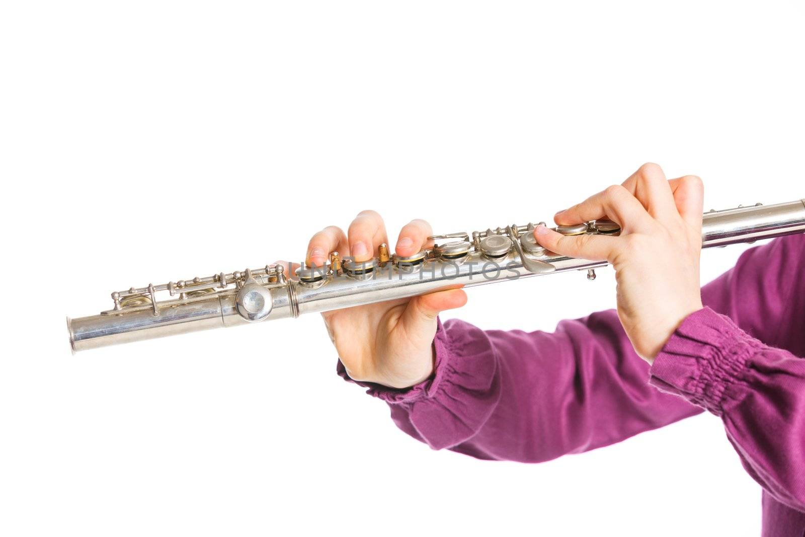 Clouse up view fingers playing on the transverse flute. Isolated on a white background