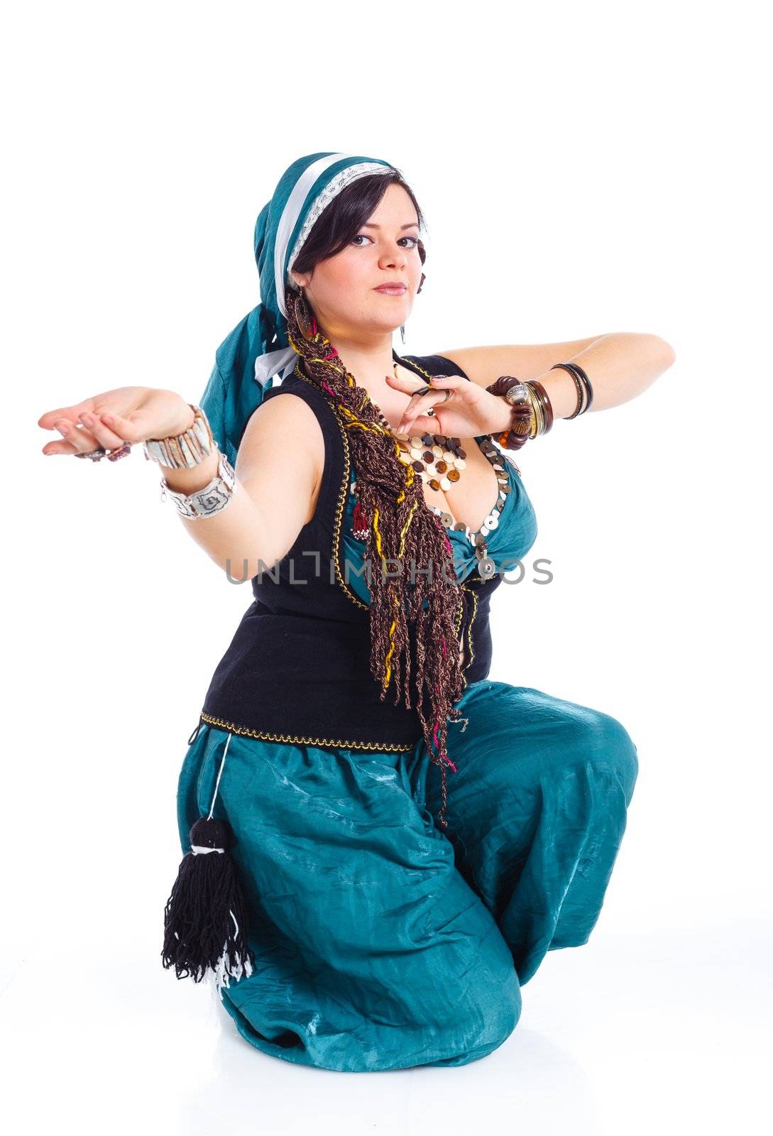 Oriental dancer in blue costume over white background
