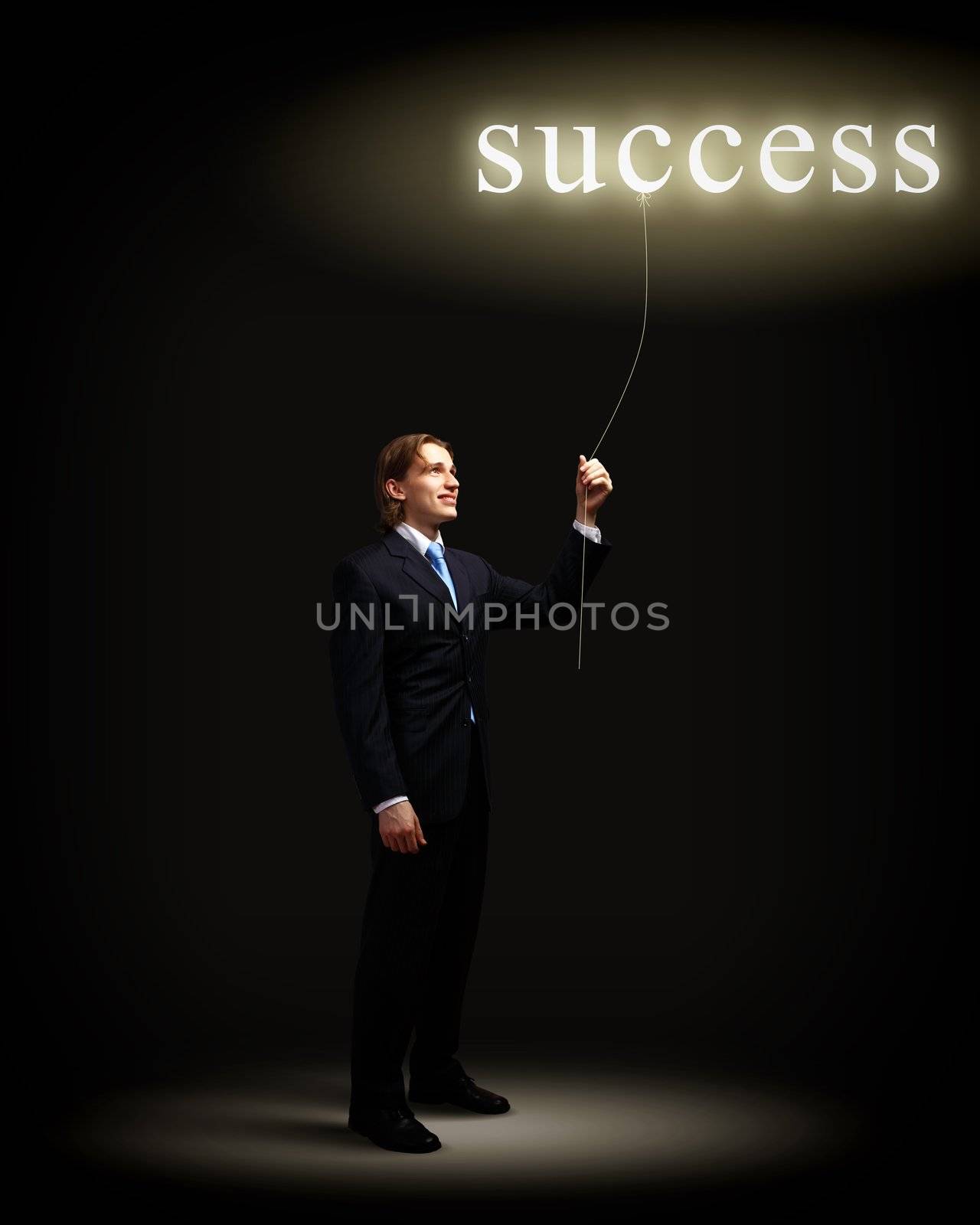 Light bulb and a business person as symbols of creativity in business