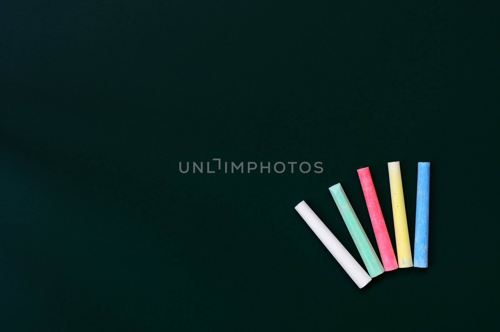 Blank chalkboard background with colorful chalk for text writing and design