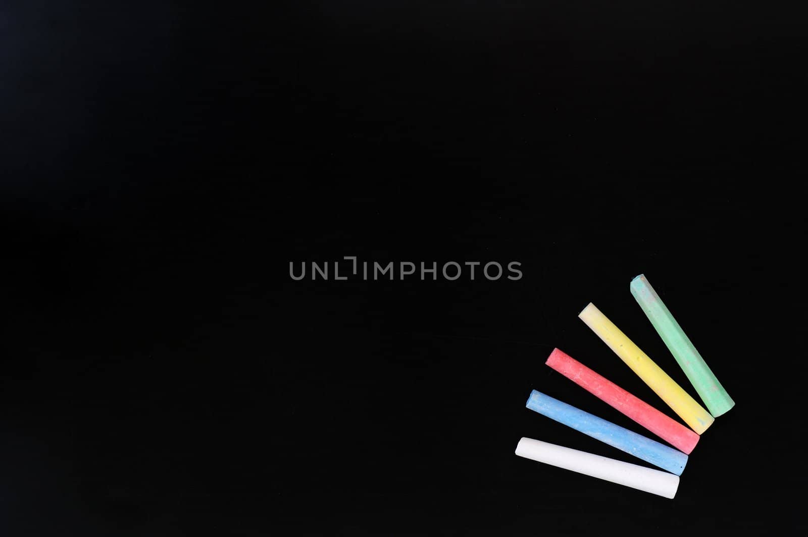 Blank blackboard background with colorful chalk for text writing and design