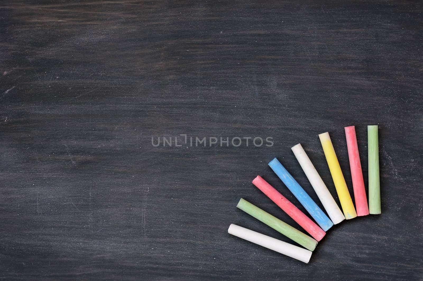 Blank smudged blackboard background with colorful chalk for text writing and design