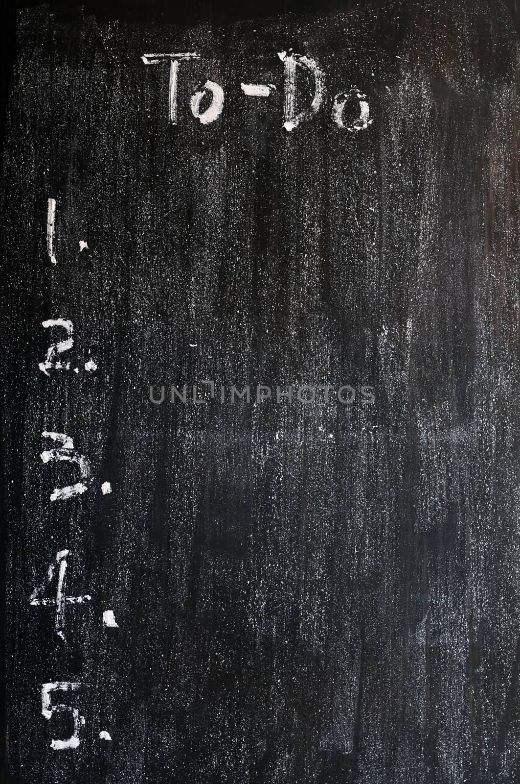 Blank to-do list drawn with white chalk on a smudged blackboard