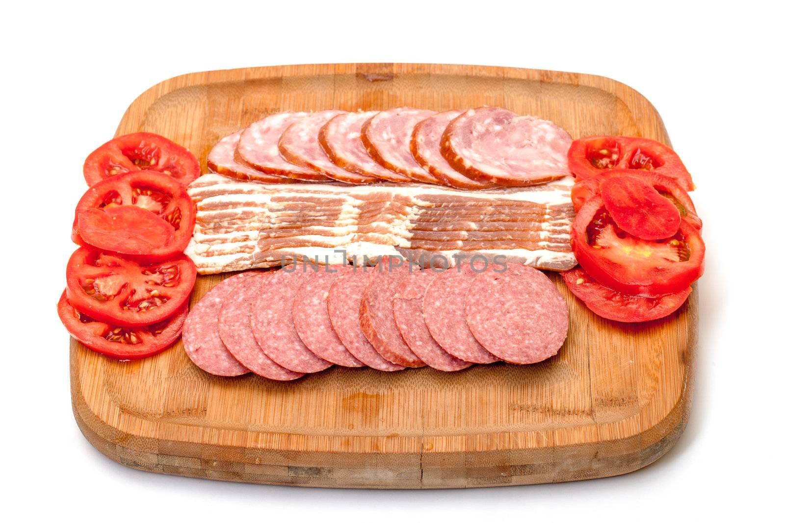 Assorted Slice Sausage, Bacon and Tomato on Cutting Board, isolated