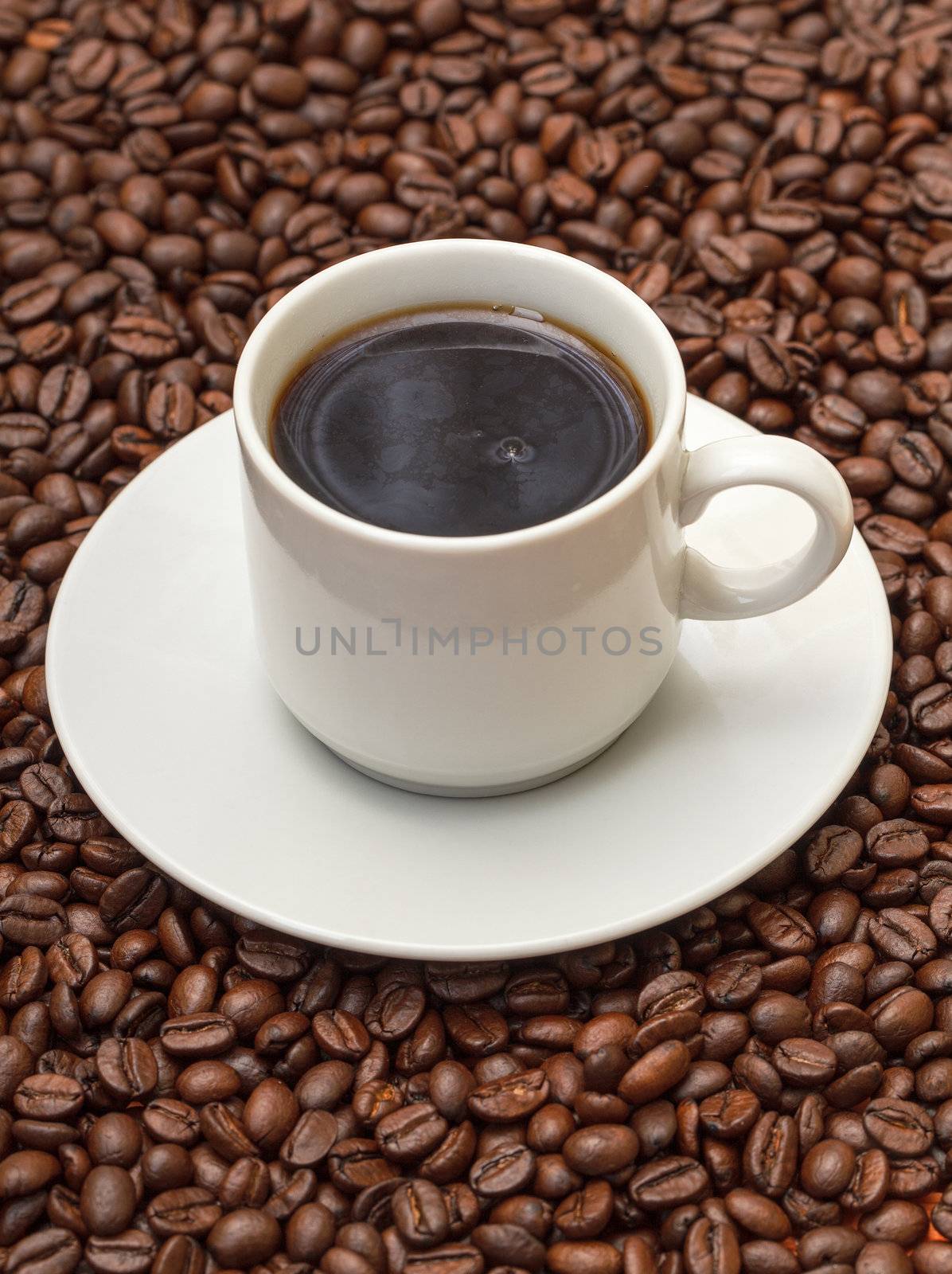 Cup with Hot Coffee on Background Coffee Beans