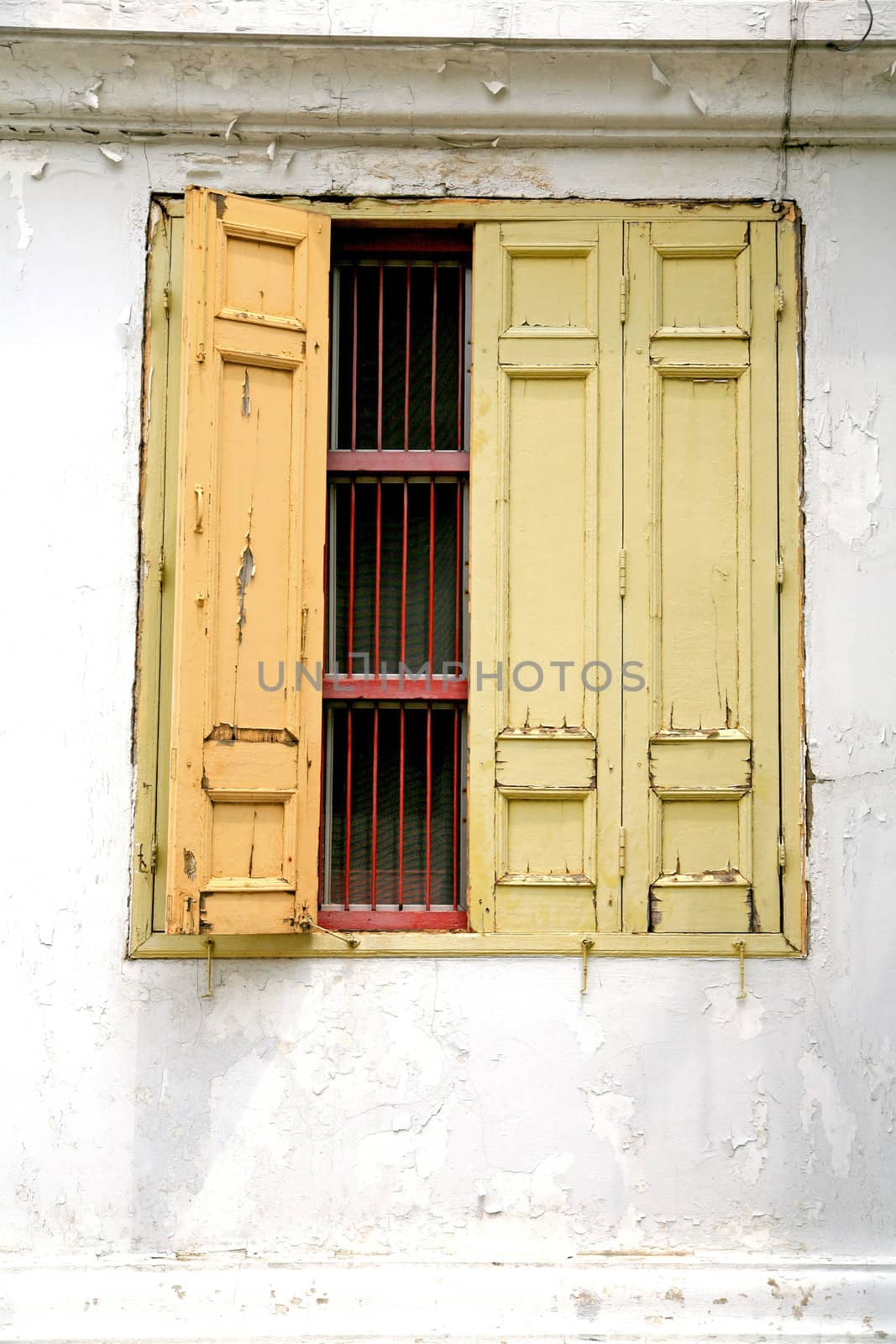 Old wooden door, the yellow part of the Thai temple.