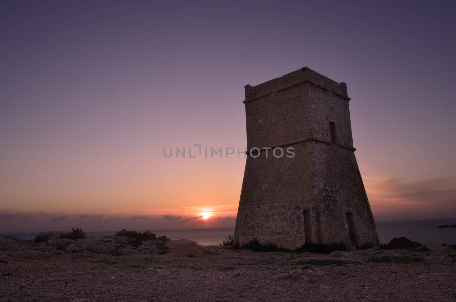 Sunset behind the tower - Malta