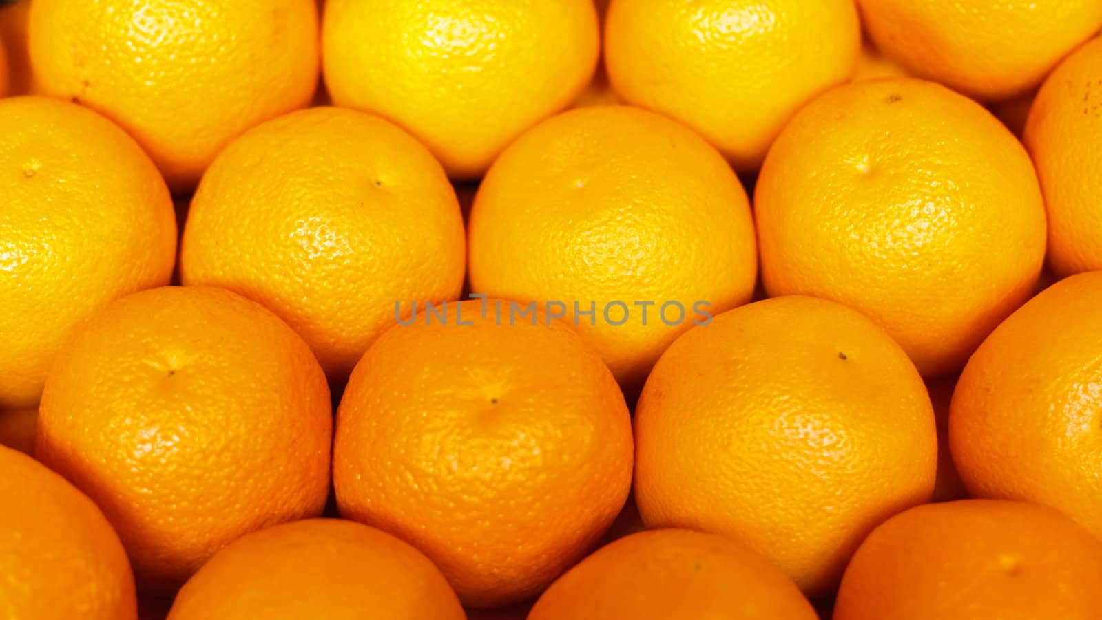 Pile of bright ripe oranges at the farmers market