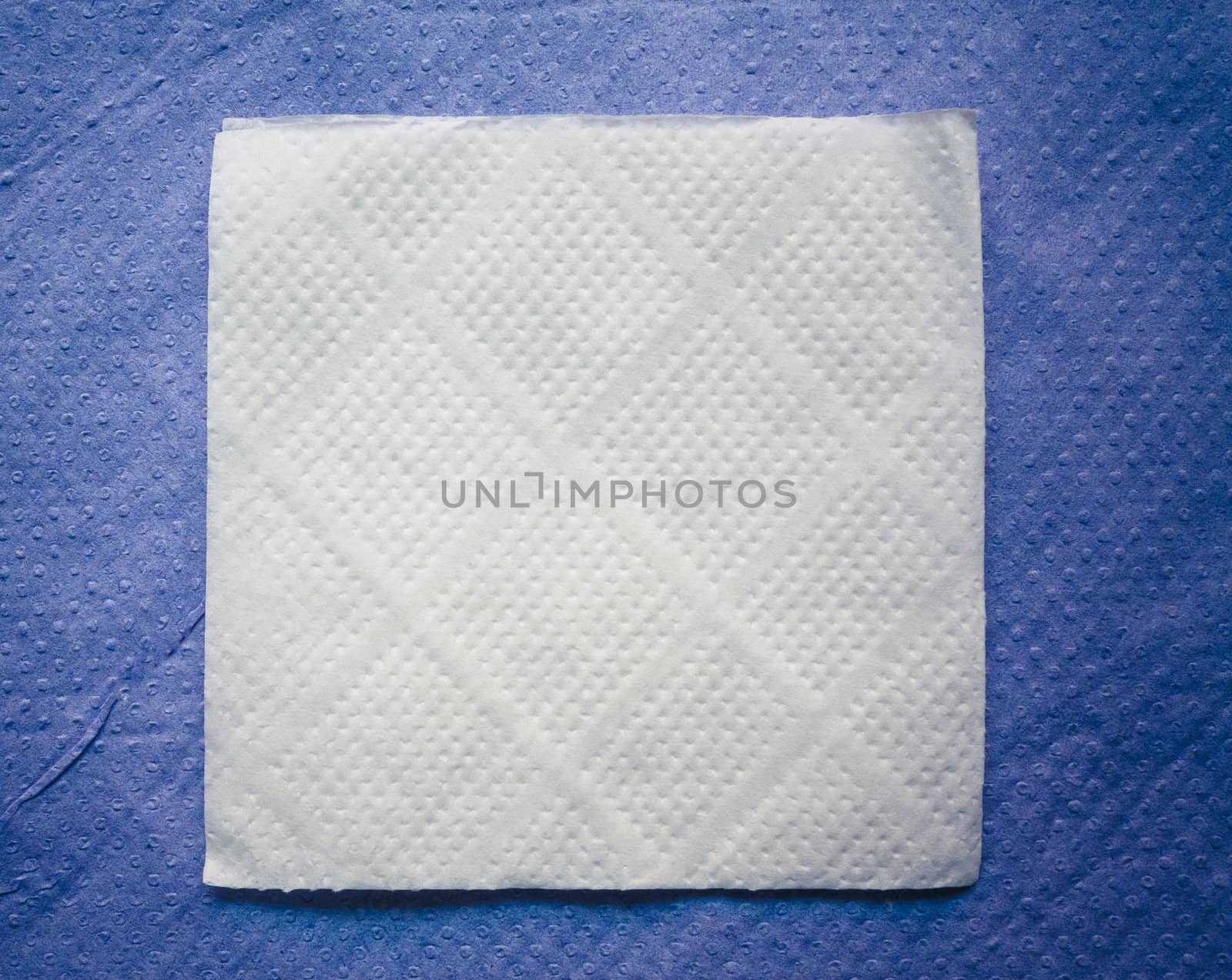 Paper napkin on blue napkin background by ryhor